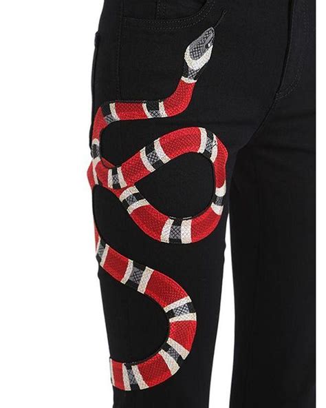 black jeans with snake gucci|gucci snake embroidered jeans.